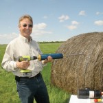 man testing hay quality