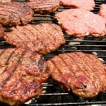 hamburger patties on a barbeque