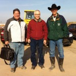 Dr. Barry Robinson (centre) visits with Americans Phil George (l) and feedlot consultant Mark Dodd.