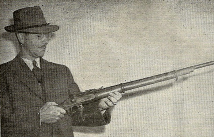 pioneer man with early model rifle