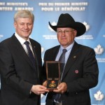 CWA CEO Reed Andrews accepts the Prime Minister's Volunteer Award.