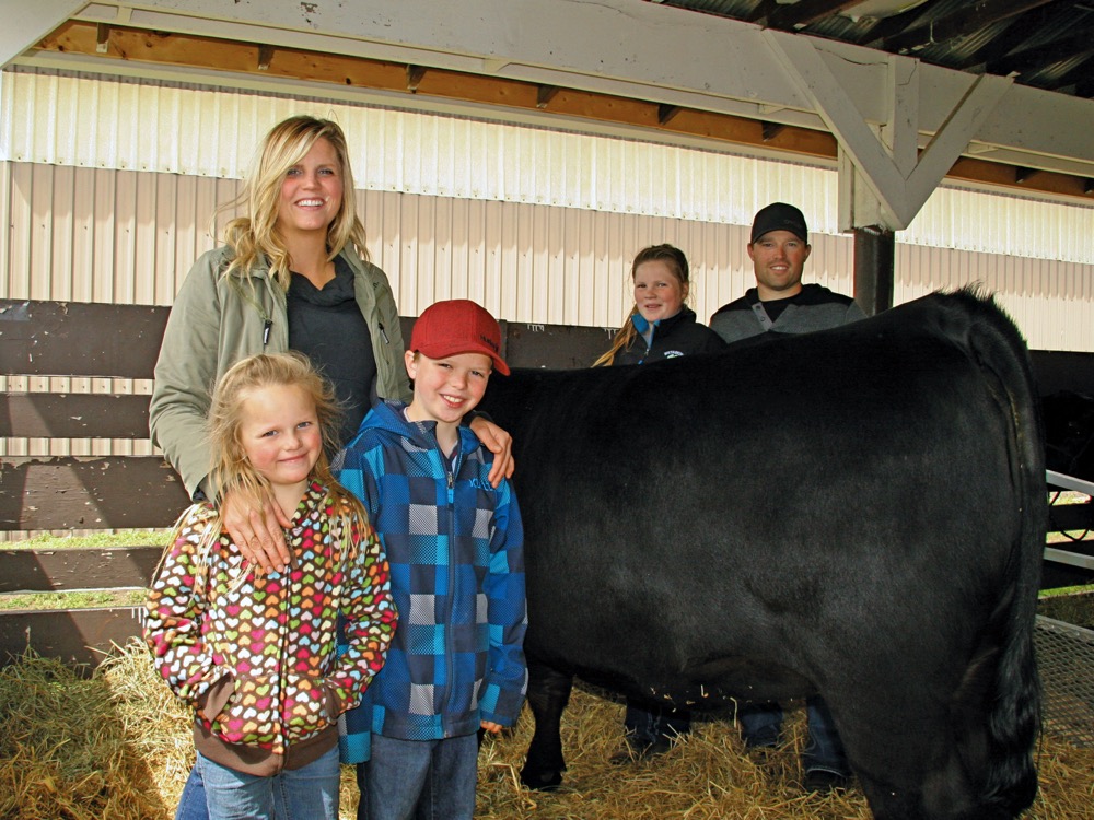 Sarah and Logan Wray with their children Georgia, Bella and Luke.