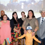Family members joined Miles and Sheri Anderson in accepting the Environmental Stewardship Award for Saskatchewan (l. to r.): Abel Goodwin, Rick Goodwin, Carlee Goodwin, Tori Knudson, Quinn Folk, Sheri Anderson, Anderson Goodwin and Miles Anderson. Missing are Kacy Lee Anderson, Keith Folk and Dallas Knudson.