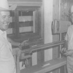 Brothers Tony and Joe Perlich (above) stand beside the first scale they used as they were about to open their livestock auction service near Lethbridge in August 1967.