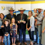 The Hagan families of Virden, Man., (l to r): Erin, Alistair, Slade and Harley-Mae, Shawne and Jocelyn, Thomas, Rory and Felicity accepting the National Blue-winged Teal Award.