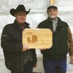 CAA senior director of business development BC/AB Brian Good presents the 50-year CAA Heritage Award to Doug Munton (r) of Benchmark Angus.