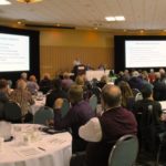 Farmers and ag industry representatives listen to GWU president Gerry Gault at Wednesday’s Grain Handling and Transportation Summit in Saskatoon. (Lisa Guenther photo)
