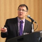 Cliff Jamieson of DTN addresses grain summit delegates in Saskatoon on March 26. (Lisa Guenther photo)