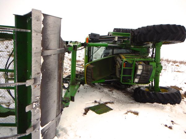 This stolen Deere 6400 did a complete rollover Wednesday while trying to back down a hill in the Blackfalds, Alta. area with Mounties in pursuit. (Photo courtesy Blackfalds RCMP)
