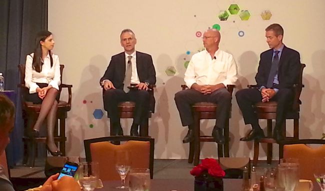 Barbara Aguiar (l) of BASF moderates a panel including Aurelio Pavinato of SLC Agricola; Brian Nunemaker of Oak Prairie Farms; and Charles Hall of the North Carolina Soybean Producers Association. (Leeann Minogue photo)
