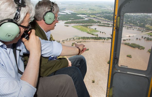 Prime Minister Stephen Harper (right) and Manitoba Premier Greg Selinger  survey flood damage in the Brandon area from the air on Sunday. (PMO photo by Jill Thompson)

