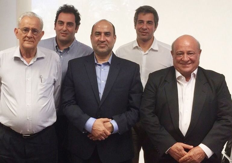 Officials from SALIC and Minerva Foods, shown here in a SALIC photo, signed a deal Wednesday for the Saudi firm to take a 19.95 per cent stake in the beef export company. (Salic.com)
