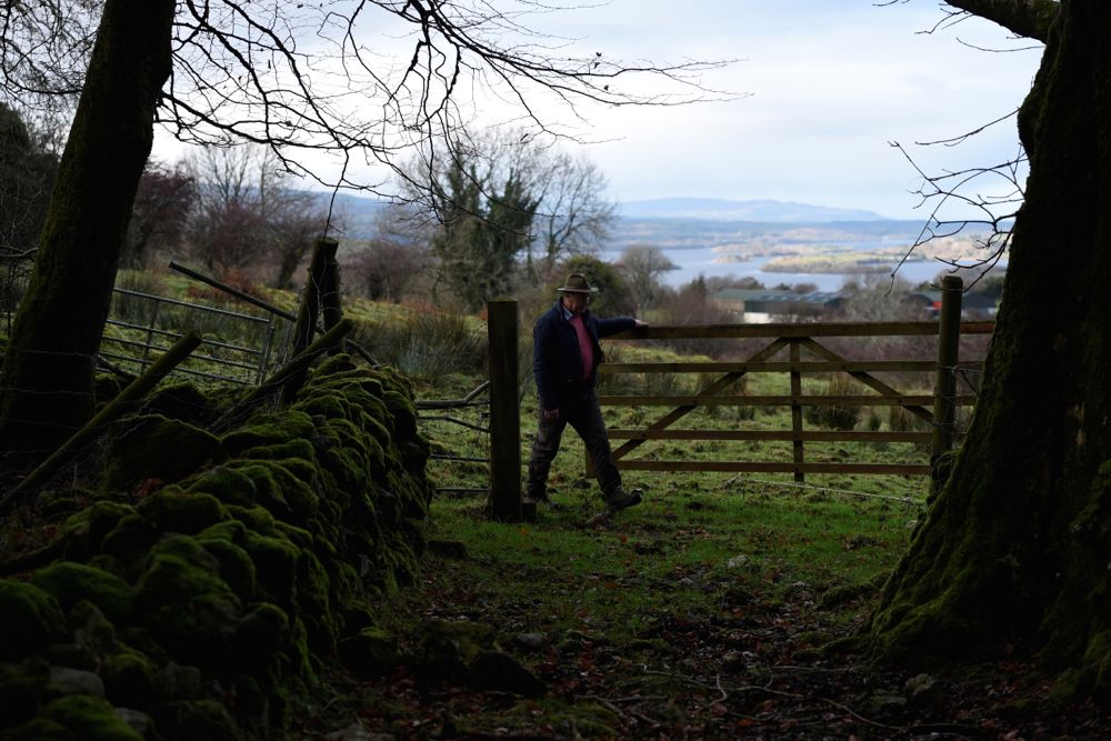 Farmer John Sheridan opens a gate on a farm which straddles both borders where the gate marks the exact border between Ireland and Northern Ireland between County Cavan and County Fermanagh near Florencecourt, Northern Ireland on Nov. 30. (Clodagh Kilcoyne photo for Reuters)
