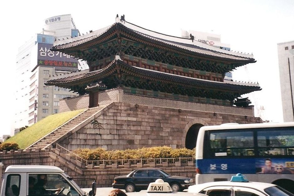 Namdaemun, the “Great Southern Gate” in the walls that once surrounded the city of Seoul. This photo was taken before a 2008 fire damaged the gate’s wooden structure, which was restored by May 2013. (CIA.gov)
