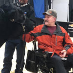 Glen Gabel checks over an Angus bull. Read his story at bottom.