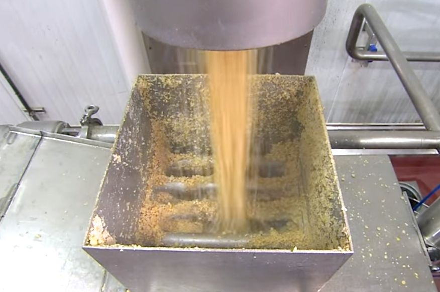 Cracked soybeans enter a SunOpta soymilk processing plant at Modesto, California. (Video screengrab from SunOpta.com via YouTube)
