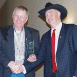 Martin Unrau (left) receives his lifetime achievement award from Tom Teichroeb, Manitoba Beef Producers president.