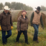 Randy, Sandra and Luke Radau stroll through the bale yard.
