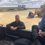 Brad Welter speaks to radio reporter Jack Dawes and Kevin Hursh during a Sask Farm Writer Association media tour on June 8.