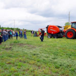 Hay and silage day attendees take to the field June 20, 2019, for equipment demonstrations at Manitoba Beef and Forage Initiatives north of Brandon.