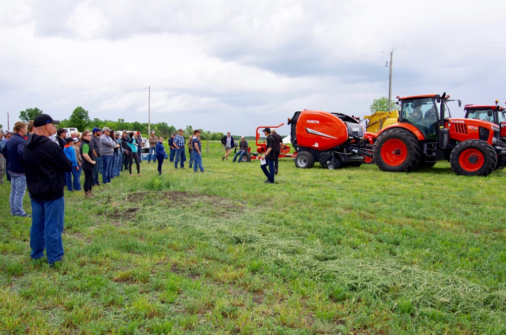 Hay and silage day attendees take to the field June 20, 2019, for equipment demonstrations at Manitoba Beef and Forage Initiatives north of Brandon.