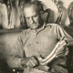 Wilf Hodgson of Dorothy, Alta. shown working on one of his Juniper carvings.