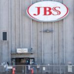 Employees walk around with face masks at the JBS USA meat packing plant at Greeley, Colorado on April 14, 2020. (File photo: Reuters/Shannon Stapleton)