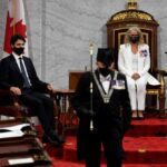 Gov. Gen. Julie Payette looks on with Chief of Defence Staff Jonathan Vance (l) and Prime Minister Justin Trudeau as the Usher of the Black Rod Greg Peters leaves to summon the House of Commons to come listen to the throne speech in the Senate chamber in Ottawa on Sept. 23, 2020. (Adrian Wyld pool photo via Reuters)