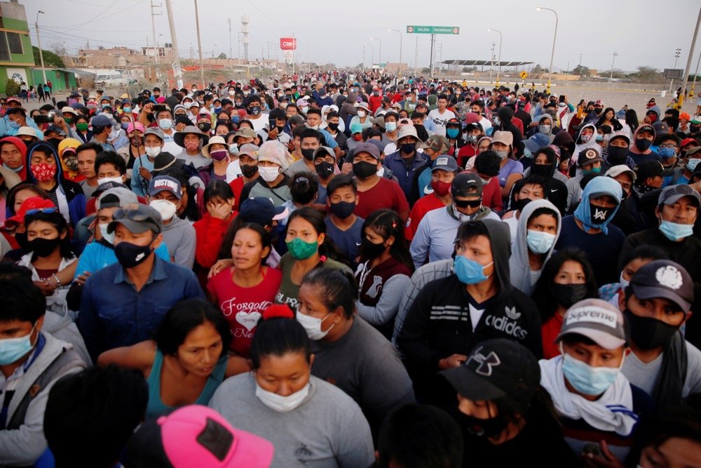 Agricultural workers gather on Dec. 2, 2020, whilst blocking the Panamericana Sur highway at Villacuri, Peru, during a protest over a long-standing but controversial agrarian law. (Photo: Reuters/Sebastian Castaneda)
