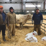 Three generations of the Oberle Farm with the triplets. Left to right: grandfather Ralph Oberle, grandson Mackenzie Oberle and son Kelly Oberle.