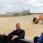 Brad Welter (centre) chats with farm reporters Jack Dawes (left) and Kevin Hursh (right) during a media tour.