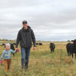 Ryan Boyd and his daughter Piper during a farm media tour in the fall of 2018.