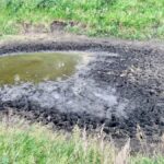 A dugout near Birtle, Man., shows the effects of an extremely dry year.