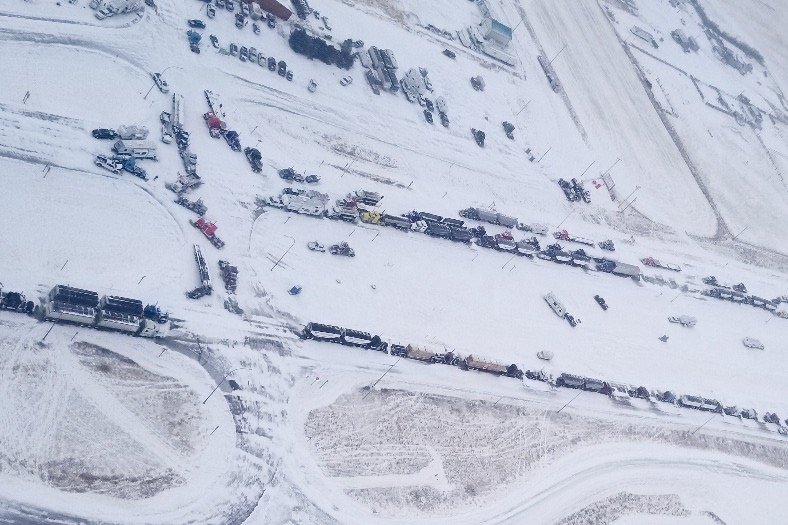 A supplied aerial photo of vehicles blocking through traffic on Feb. 1, 2022 at the Canada-U.S. border crossing between Coutts, Alta. and Sweet Grass, Montana. (Photo courtesy Alberta RCMP)
