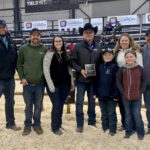 Bruce Holmquist (centre) and his family.