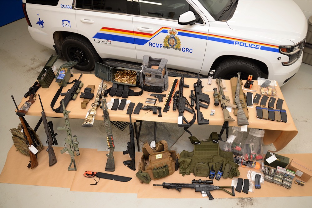 RCMP on Feb. 14, 2022 reported seizing the guns, ammunition and other items shown here during a search of three trailers "associated to" a group involved with the Coutts, Alta. border blockade. (An earlier version of this caption incorrectly quoted RCMP as saying the trailers were at the blockade.) (Photo courtesy Alberta RCMP)