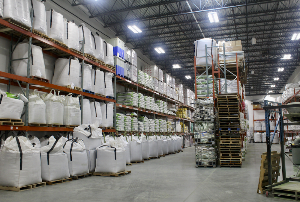 Totes of seed lined up and ready for shipment at Union Forage’s warehouse in south Calgary.