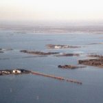 An aerial view of flooded farmland near Rosenort, Man., about 50 km south of Winnipeg, on May 6, 2022. (Manitoba Co-operator photo by Allan Dawson)