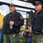 Local conservation officers speak during a field day hosted by the pilot project on June 21.
