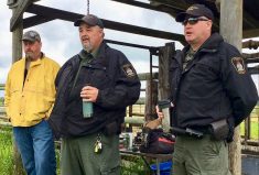 Local conservation officers speak during a field day hosted by the pilot project on June 21.