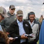 Calvin Gavelin (centre) is surrounded by field day attendees as he talks about his cover crops during the Prairie South Holistic Management field day.