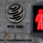 File photo of a pedestrian crossing in front of the World Trade Organization headquarters in Geneva, Switzerland on Dec. 9, 2019. (Photo: Reuters/Denis Balibouse)