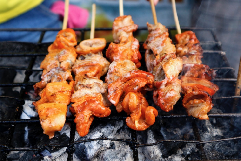File photo of grilled pork intestine on skewers at a street food stall in the Philippines. (Junpinzon/iStock/Getty Images)
