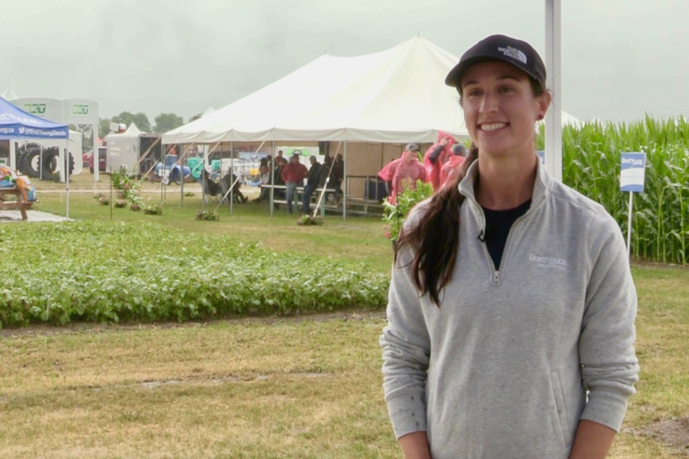 Under rainy skies on July 18, 2023 at Ag in Motion, Justine Cornelsen of Brett Young Seeds discusses soybeans’ evolving Canadian acreage base. (Glacier FarmMedia video screengrab)
