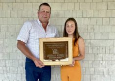 Albert Rimke presents the Bob Gordon Memorial Over- all Grand Aggregate award to Heidi McFadden.
