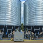 A DryAir central heating system feeds aeration fans for a row of grain bins. (Assie.ca)