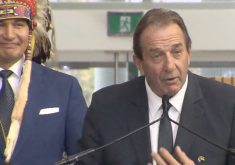 Ron Kostyshyn is sworn in on Oct. 18, 2023 as Manitoba’s minister for agriculture, with Premier Wab Kinew at left. (Government of Manitoba video screengrab via YouTube)