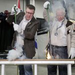Saskatchewan premier Scott Moe and retired agricultural broadcaster Jim Smalley burned the brand to officially open Canadian Western Agribition, Nov. 20.