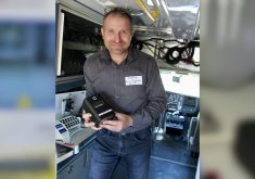 Dr. Anatoliy Trokhymchuk holding some of the equipment used to identify specific BRD-causing pathogens.