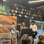 Deanne Chuiko (middle) and John Chuiko (right) speak about their virtual fencing pilot at an event hosted by Ag-West Bio in Regina, Sask.